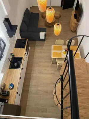 a living room with a couch and a table at Central City Loft by NEK in Chania Town