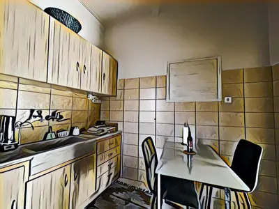 a kitchen with a table and chairs in a kitchen at Enjoy Chania in Chania Town