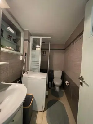 a small bathroom with a toilet and a sink at Enjoy Chania in Chania Town