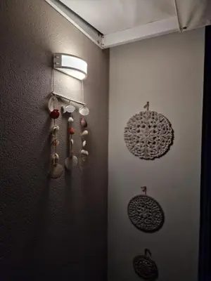 a kitchen with utensils hanging on a wall at S n G/ Best view apartment in Kissamos