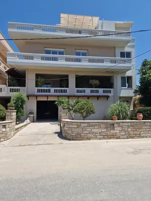 a large white building with balconies on it at S n G/ Best view apartment in Kissamos