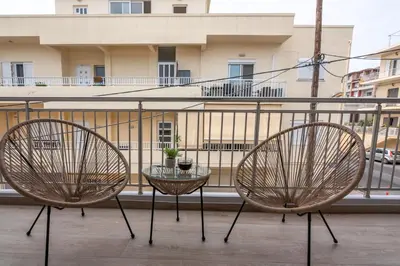 two chairs and a table on a balcony at MAGNOLIA Luxury Chania Central Apartments in Chania Town