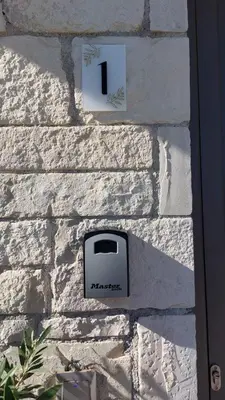 a wall with a toaster on a brick wall at Ioanna Apartment 1 in Chania Town