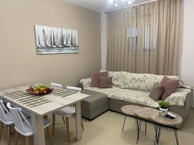 a living room with a couch and a table at Anastasia’s Home in Chania Town