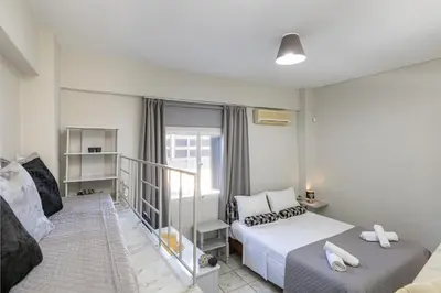 a bedroom with a bed and a balcony at Karel house in Karés