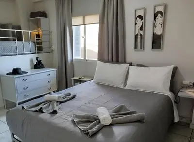 a bedroom with a bed with towels on it at Karel house in Karés