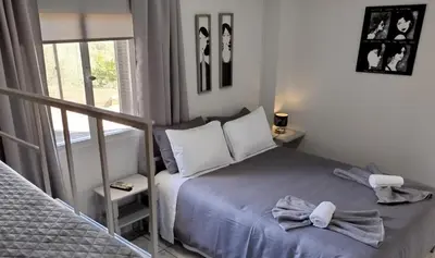 a small bedroom with a bed and a window at Karel house in Karés