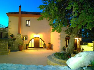 a large house with a tree in front of it at Mouri Villa in Mouríon