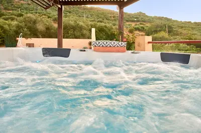 a large pool of water in a hot tub at Mouri Villa in Mouríon
