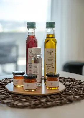 a tray with four bottles of oils on a table at Lysithea Apartments - brand new, stylish & central in Kissamos