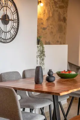 a dining room table with chairs and a bowl of fruit on it at Elma's Villa in Kissamos