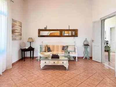 a living room with a couch and a coffee table at Villa Xanthippe in Vamos
