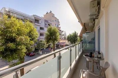 a balcony with a view of a street at Neaira City Apartment Near The Beach in Chania Town