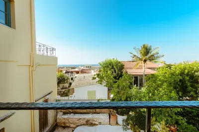 a view from the balcony of a building at Krinis houses next the old harbour in Chania Town