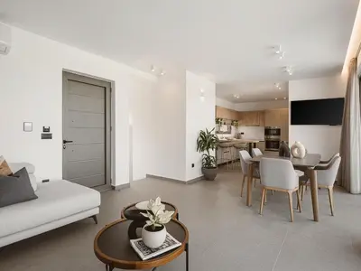 a living room with a couch and a table at Estel Residences in Chania Town