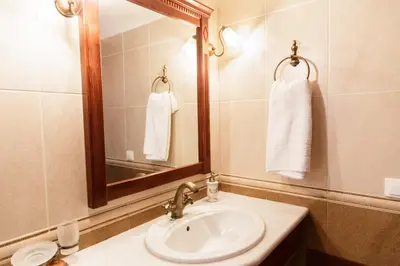 a bathroom with a sink and a mirror at Patriko Villa in Kissamos