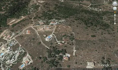 an overhead view of a city with buildings and trees at Villa Lefki in Vamos