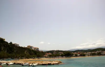 a beach with a bunch of boats in the water at Villa Lefki in Vamos