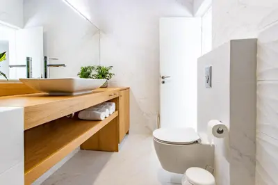 a bathroom with a sink and a toilet at Oasis by the sea in Chania Town