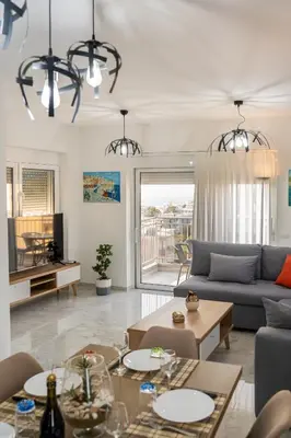 a living room with a couch and a table at EDEL Suite in Chania Town