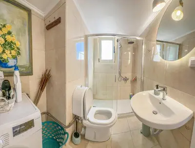 a bathroom with a toilet and a sink at Mountain Bliss Guesthouse 1 next to Sougia in Agrilés