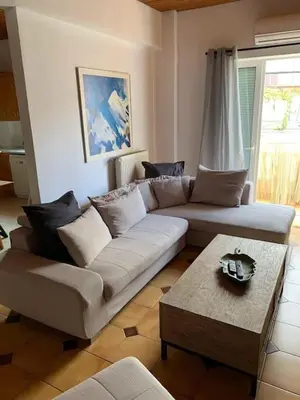 a living room with a couch and a coffee table at Stelios house in Chania Town