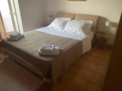 a bedroom with a bed with two towels on it at Stelios house in Chania Town