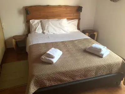 a bedroom with a bed with two towels on it at Stelios house in Chania Town