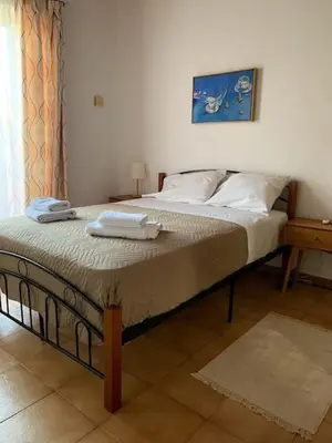 a bed with two towels on it in a room at Stelios house in Chania Town