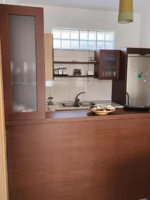 a kitchen with a counter with a plate of food on it at Nora Apartment in Almyrida in Chania Town