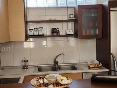 a kitchen with a plate of food on a counter at Nora Apartment in Almyrida in Chania Town