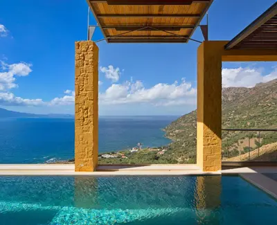 a swimming pool with a view of the ocean at Seafront Ravdoucha Epavlis Athina Villa - Pool, Gym, Sauna, Private Parking, WiFi in Ravdhoúkha