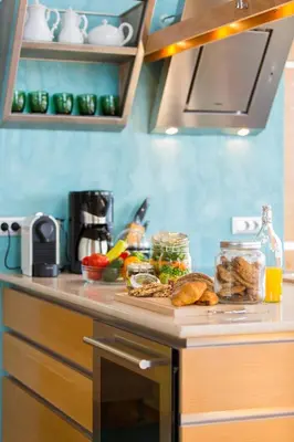 a kitchen counter with a plate of food on it at Beachfront Ravdoucha Epavlis Eleni Villa - Pool, Hot Tub, Gym, Sauna, Private Parking, WiFi in Chania Town