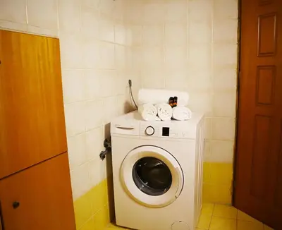 a washer and dryer in a small room at Calma Apartment Chania in Chania Town