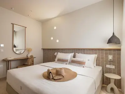 a bedroom with a bed with a hat on it at Villa Agali I 
