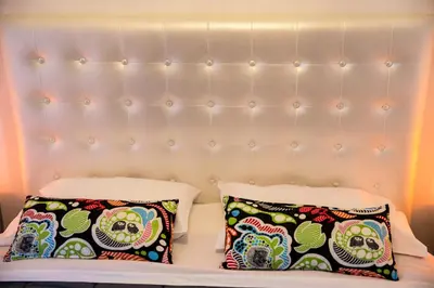 two pillows on a bed with a headboard at Villa Pandora - Angela & Michali in Maleme