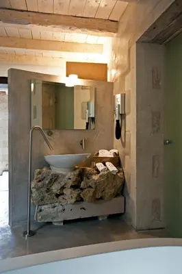 a bathroom with a sink and a large mirror at Athermigo Boutique Estate in Gavalochori