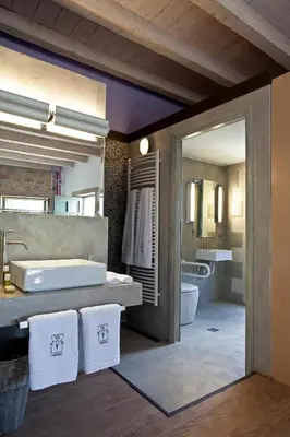 a large bathroom with a tub and a sink at Athermigo Boutique Estate in Gavalochori