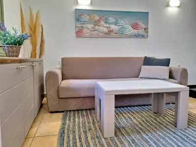 a living room with a couch and a coffee table at Icarus Loft Old Town rooftop terrace in Chania Town
