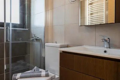 a bathroom with a toilet and a sink and a shower at Villa Katerina with Private Pool in Chania Town