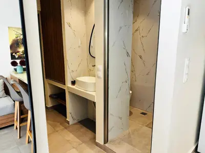 a bathroom with a sink and a mirror at Matina Room in Chania Town