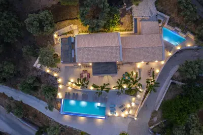 an aerial view of a house with a pool at night at Alexandras's Mansion - Fragkia's House in Ayiá