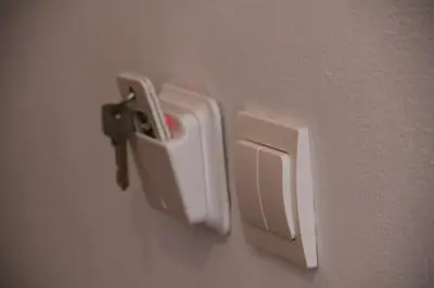 a white holder on the side of a wall at Hotel Stavris in Khóra Sfakíon