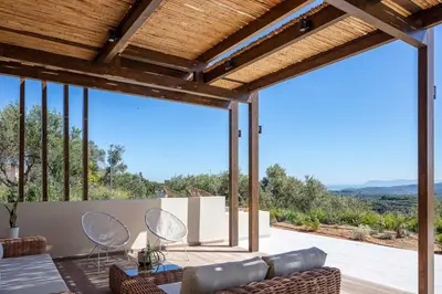 a living room with a view of the mountains at Villa Aglaea I Saltwater Pool & Amazing Seaview! in Chania Town