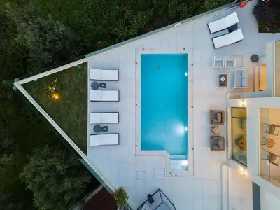 an overhead view of a building with a swimming pool at Kalyves Royal Villa I 