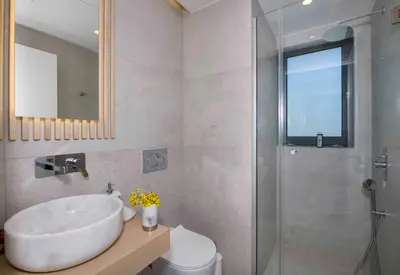 a bathroom with a sink and a shower at Kalyves Royal Villa I 