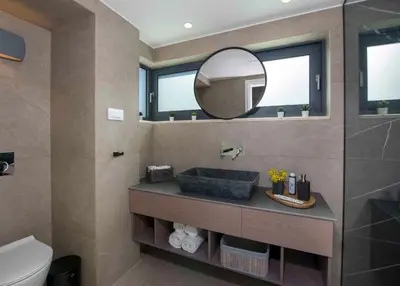 a bathroom with a sink and a mirror at Kalyves Royal Villa I 