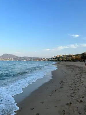 a beach with the ocean and the shoreline at Carlas House, Kalyves in Tsivarás