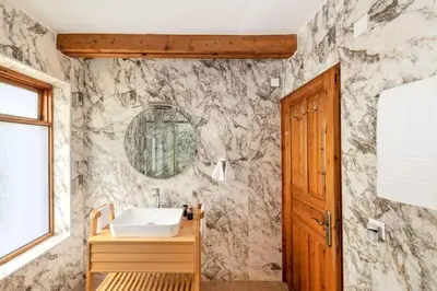 a bathroom with a sink and a mirror at Yiayia's Place in Chania in Chania Town