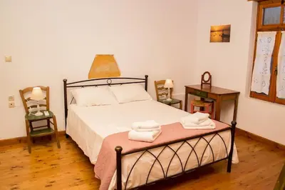 a bedroom with a bed with towels on it at Traditional house in Fres in Karés